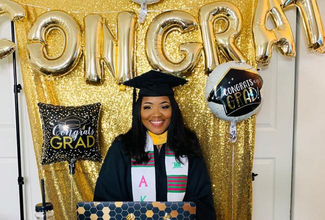 A student graduating virtually