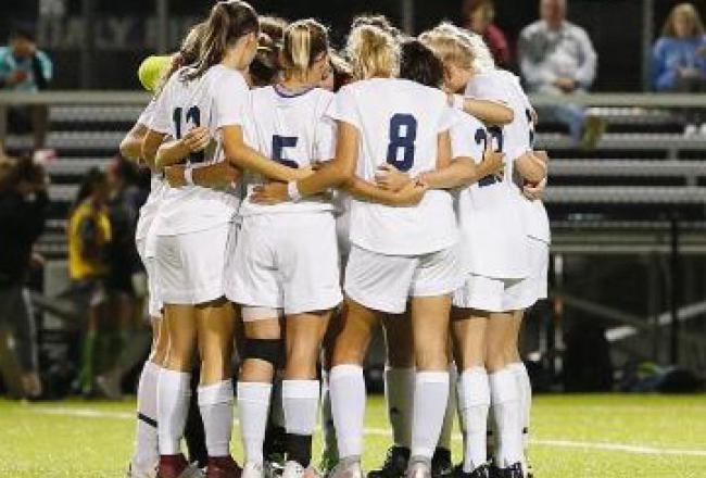 Soccer Team in Huddle