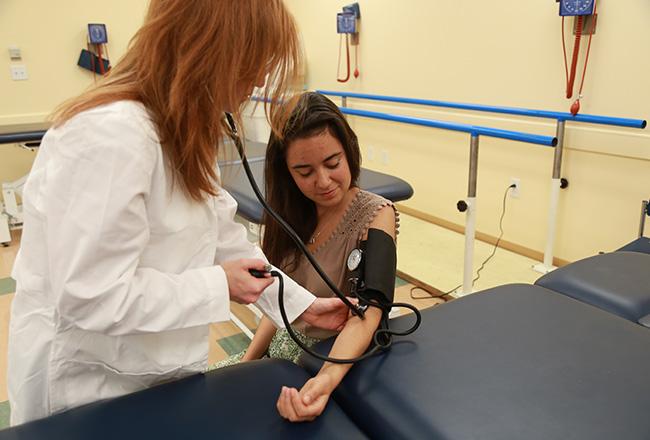 Dietetic Internship student taking a blood pressure reading