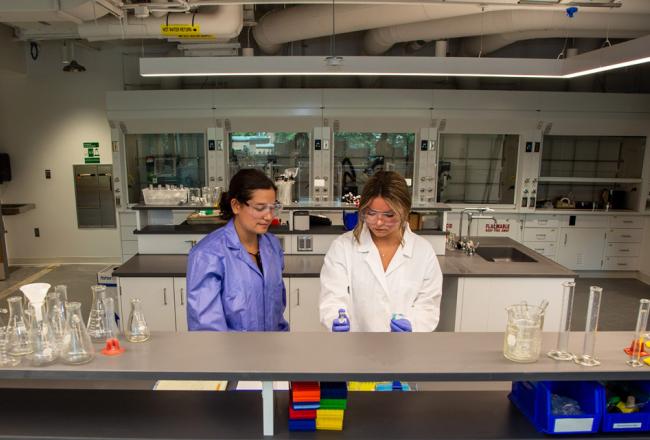 Two students working in Science Center lab