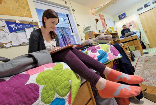 Students inside Simmons residence hall dorm room