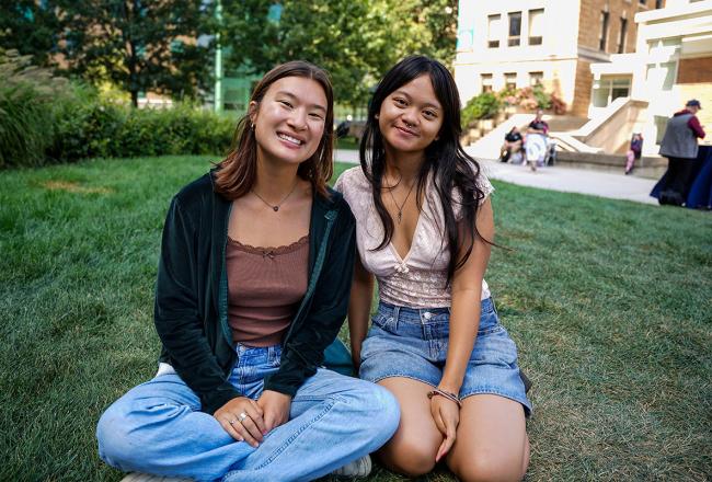 Two Simmons students enjoying a fall day on the Simmons University campus