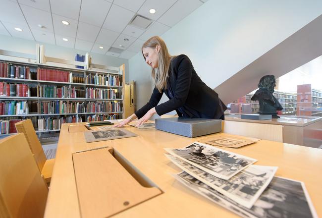 A Simmons LIS student working with archival materials