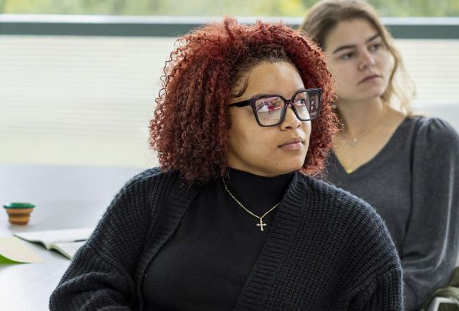 Two Simmons graduate students paying attention in class