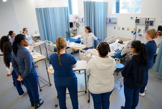 Simmons School of Nursing students and faculty in the Nursing Simulation Center, photograph by Ashley Purvis.