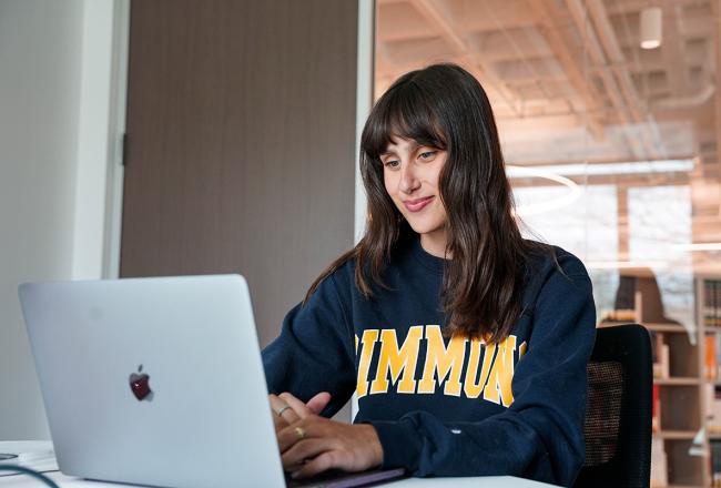 Student at laptop in study area