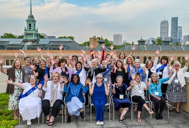 Group shot from Reunion 2026 taken on roof patio of Helen Drinan Building