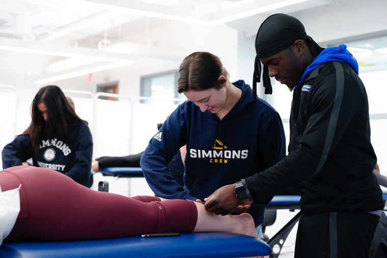 Physical Therapy students doing hands-on practice in the PT lab