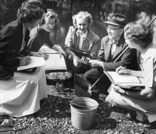 Archive photo of faculty and students doing outdoor field work in the 1940s