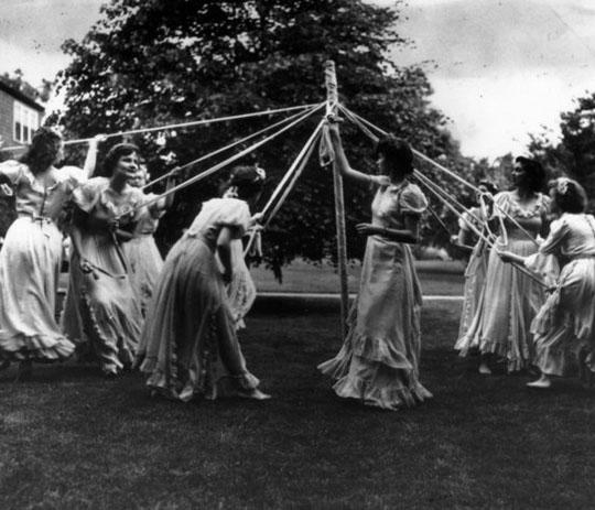 Archive photo of students dancing around the May pole on May Day 1950