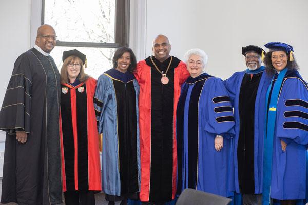 Speakers gather for a photo at the Investiture ceremony