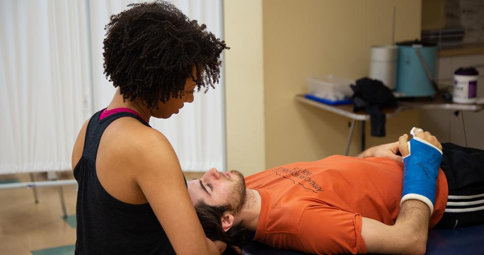 Physical therapist working with a patient