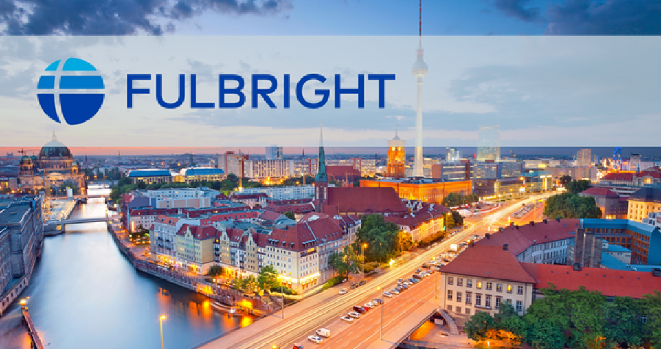 An aerial shot of a city with the Fulbright logo overlay