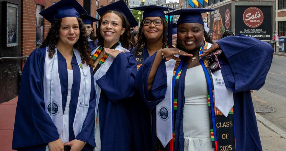 4 Simmons students lined up for Commencement
