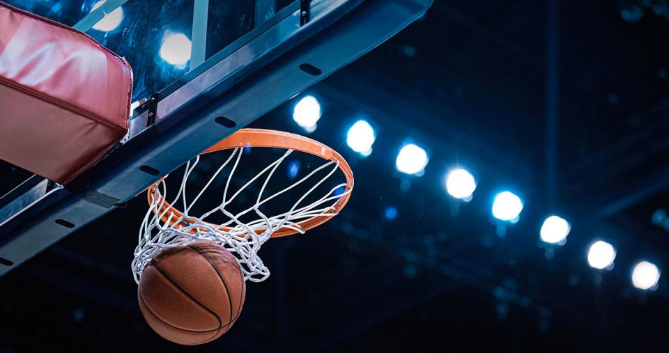 A basketball swishing through the net