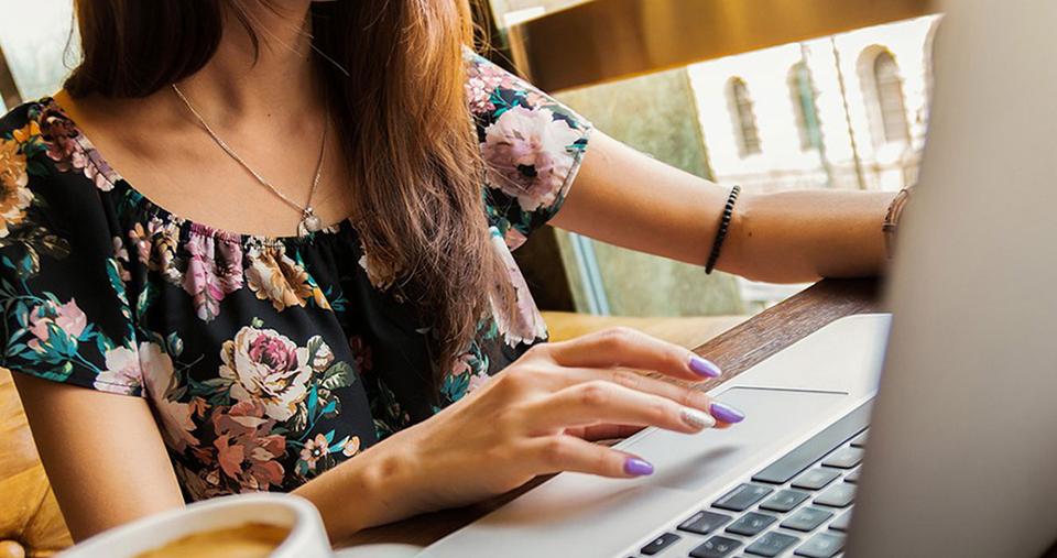 A student working on a laptop with a cup of coffee on their desk. Image by Pexels from Pixabay.