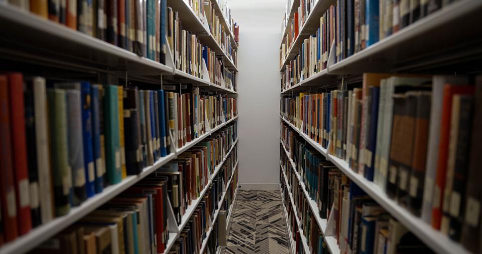 Shelves of books in the Simmons University library