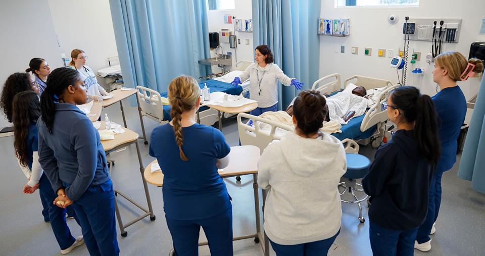 Simmons School of Nursing students and faculty in the Nursing Simulation Center, photograph by Ashley Purvis.