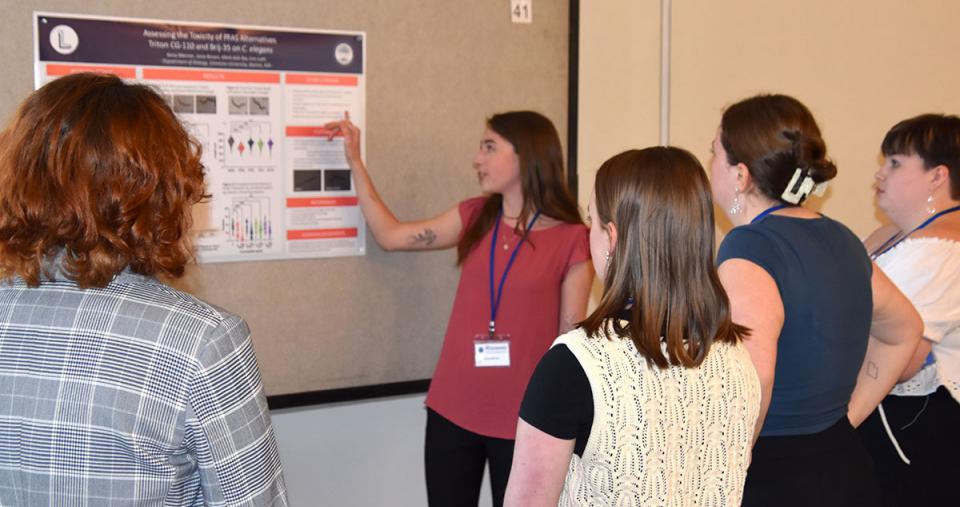 A student presenting her work at the STEM Colloquium