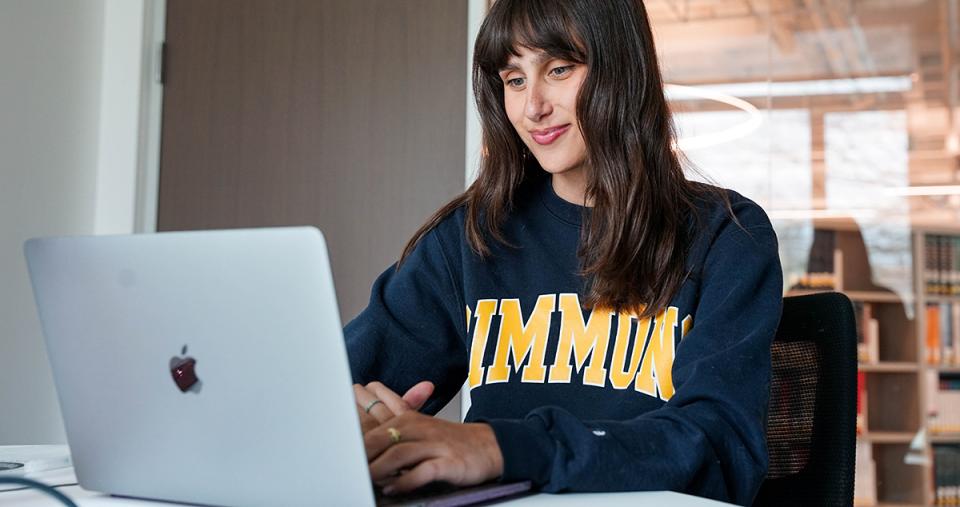 Student at laptop in study area