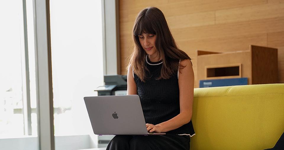Student sitting with laptop