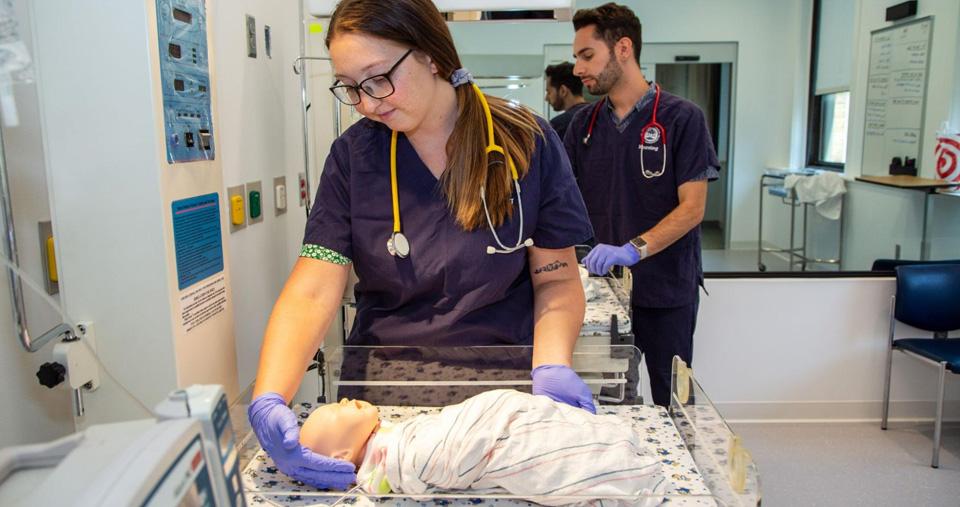 Nursing student working in model maternity ward