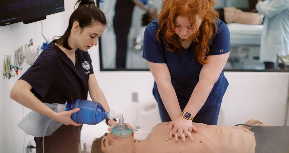 Nursing students in simulation lab practicing CPR
