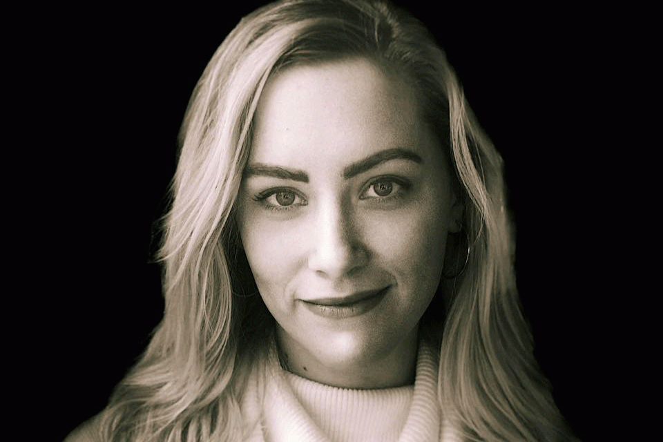 Headshot of Devon Zoe Eckert