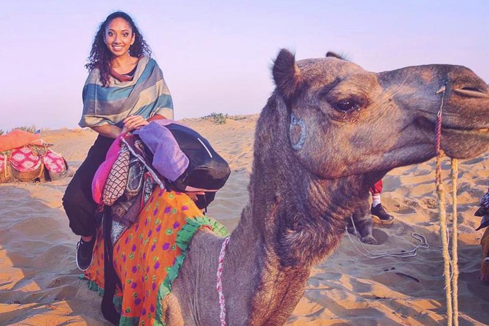 Samantha Sochan riding a camel.