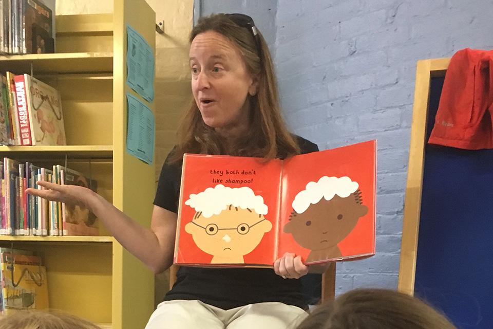 Alison Mitchell reading children's book.