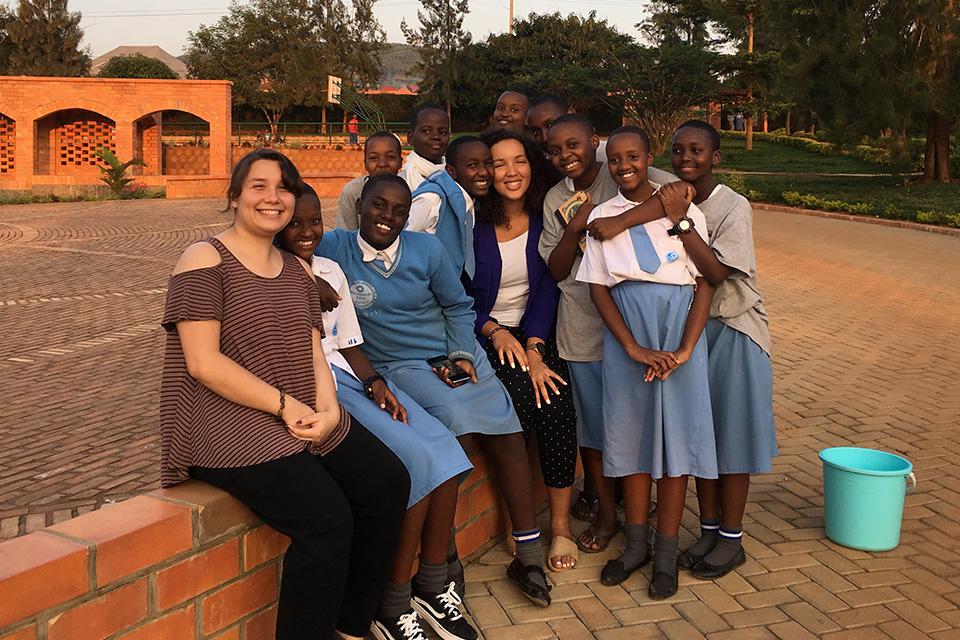 Heather Moeykens and Vanessa Burns pose with MGS students.