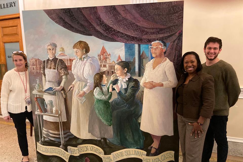 State House Curator Susan Greendyke Lachevre (left), Director of Operations at Simmons’ Gwen Ifill College Donna Graham-Stewartson (right), and Simmons Events and Gallery Specialist Kyle Mendelsohn (far right) assist during the State House installation