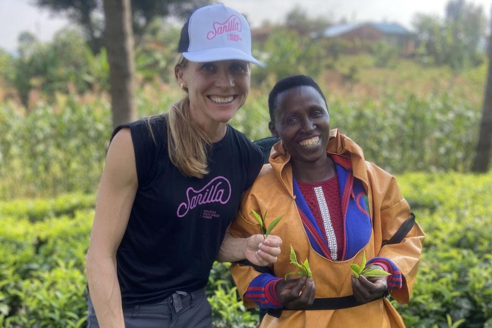 Sara Stender Delaney and Beatrice, a renowned specialty tea plucker in the northern province of Rwanda, on the Crop to Cup Tea trip in January 2023. Photo by Sean Moore