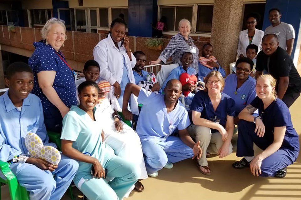 Marilyn Riley with a group of patients and others involved with Team Heart in Rwanda